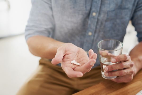 Top Tips on Help Prevent MPH Male Pattern Hair Loss man taking pills | Lifestyle