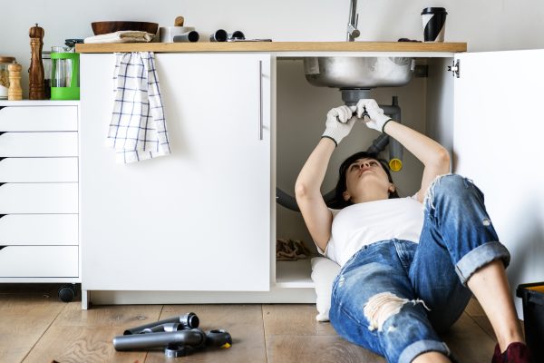 Top 10 Signs of Unusual Intelligence woman fixing sink | Business & Finance