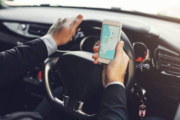 Know How You Can Boost Your Fleet Business with a GPS Tracker driving car with GPS tracker | Business & Finance